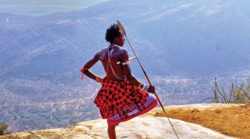 A-Samburu-moran-enjoys-a-view-from-the-peak-of-Mt-Ololokwe-1200x900-1